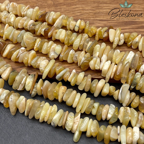 Опал желтый сколы шлифованные (3-7)*(10-16) мм